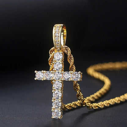 Cross pendant necklace with stone detailing on a dark background