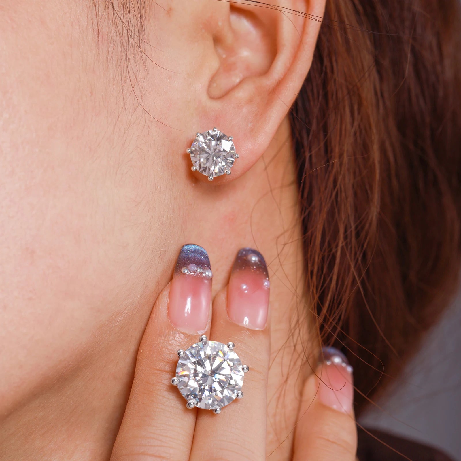 VVS Moissanite 0.5-12ct 8 Prong Stud Earrings worn by a model, showcasing their luxurious sparkle.