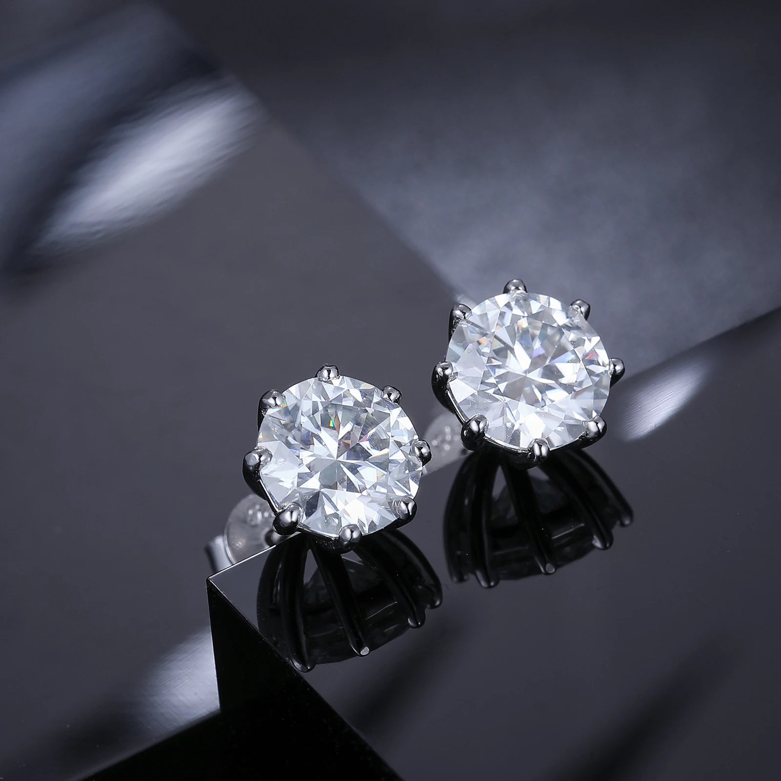 VVS Moissanite 0.5-12ct 8 Prong Stud Earrings showcased with premium sparkle and elegance on a reflective surface.