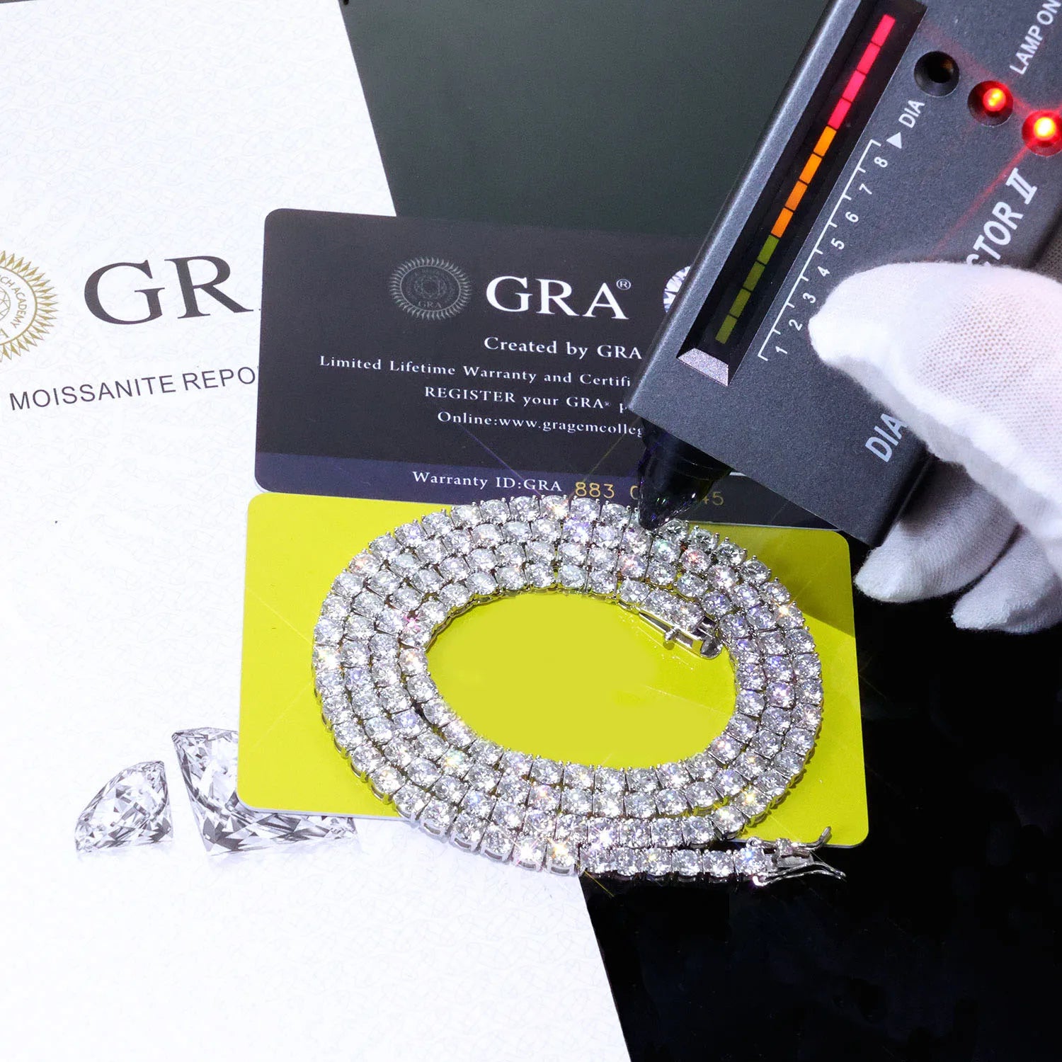 VVS Moissanite Tennis Chain displayed with GRA certification and diamond tester, showcasing its luxury and authenticity.