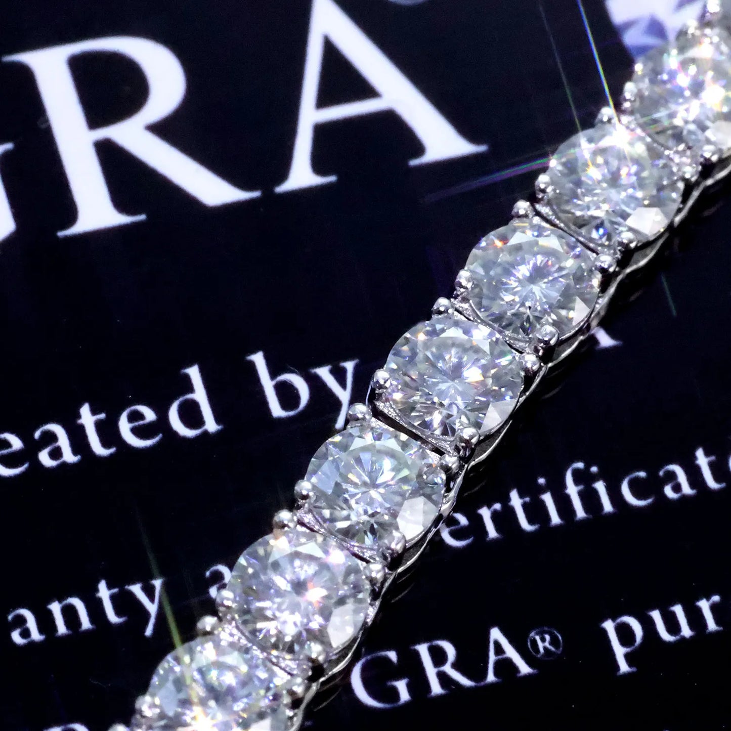 VVS Moissanite Tennis Chain with sparkling stones showcasing luxury and brilliance on a certificate background.