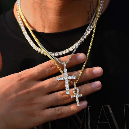 Model wearing cross pendant necklace with hand on chest