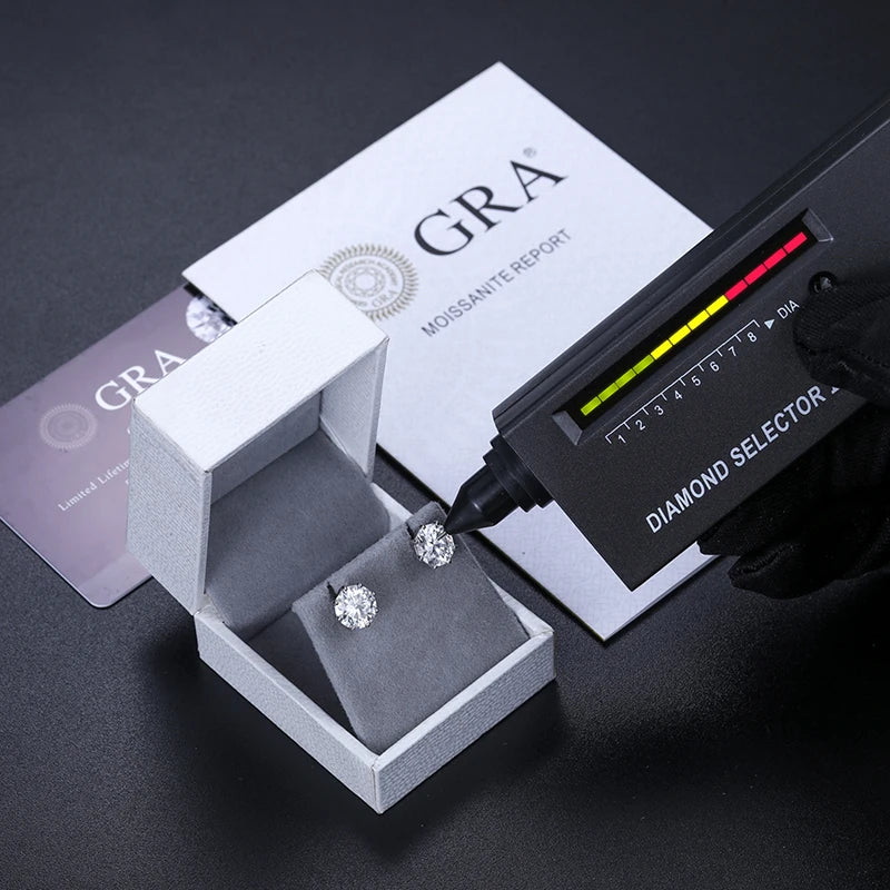 VVS Moissanite 0.5-12ct 8 Prong Stud Earrings displayed in a box with a diamond selector and GRA report.